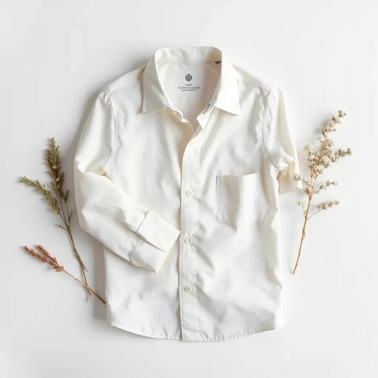 Neatly pressed dress shirt laid flat with collar, cuffs, and hem clearly visible