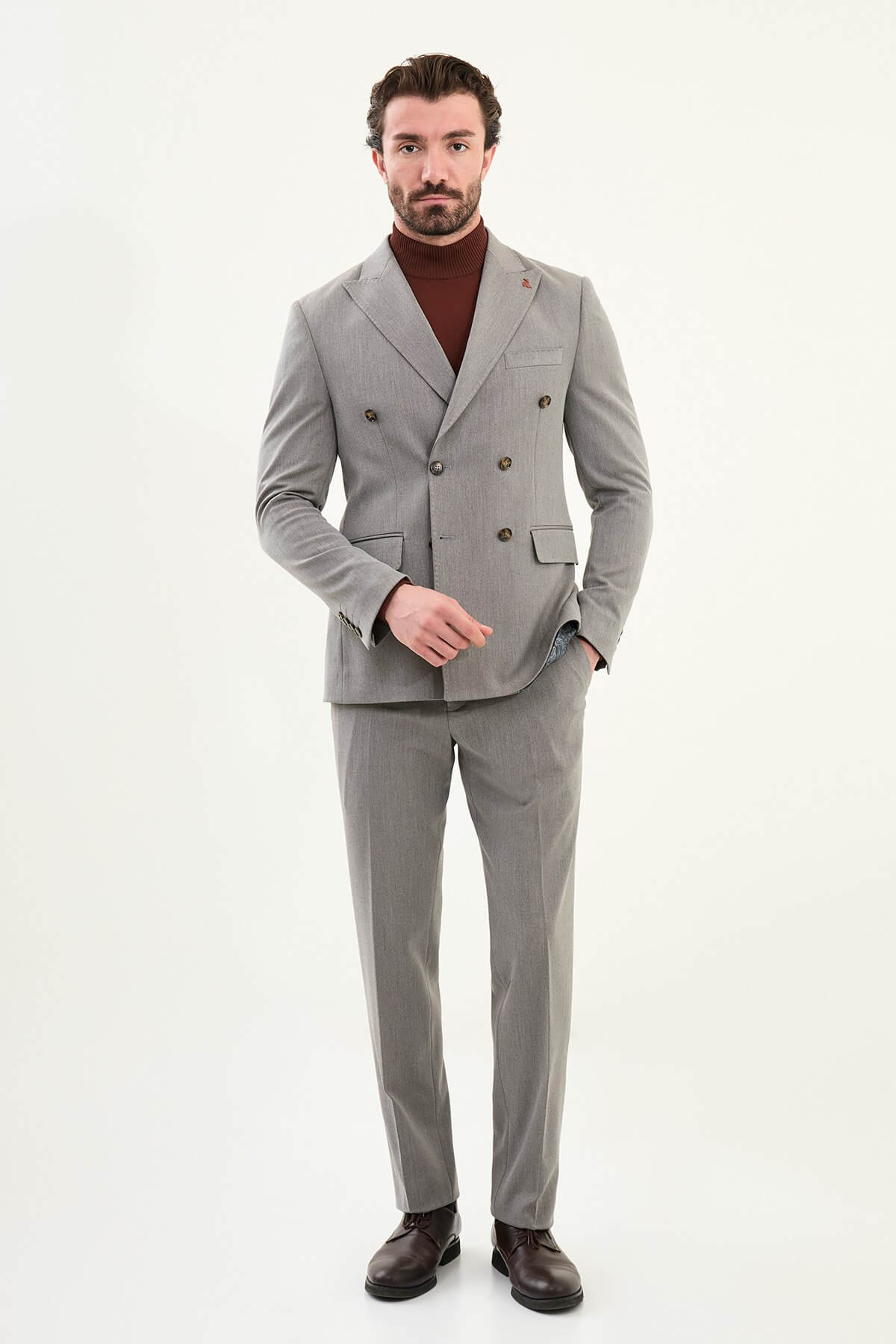 Men’s heather gray slim-fit double-breasted wool-blend suit with wide peak lapels, barchetta chest pocket, tortoiseshell buttons, and red origami lapel pin.