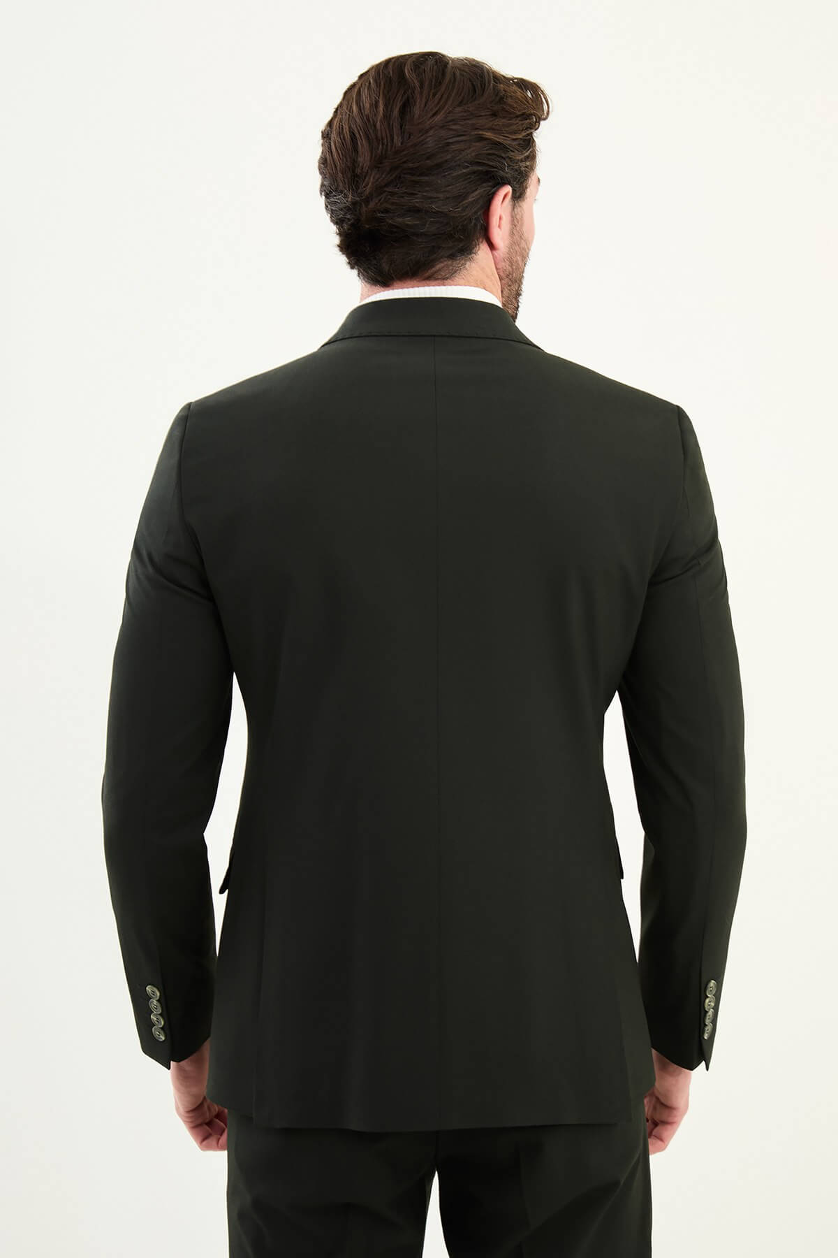 Men’s matte obsidian black slim-fit double-breasted 6x2 suit with peak lapels, cotton-wool-viscose blend with 4-way stretch for wrinkle-resistant wear, styled with a crisp white turtleneck.