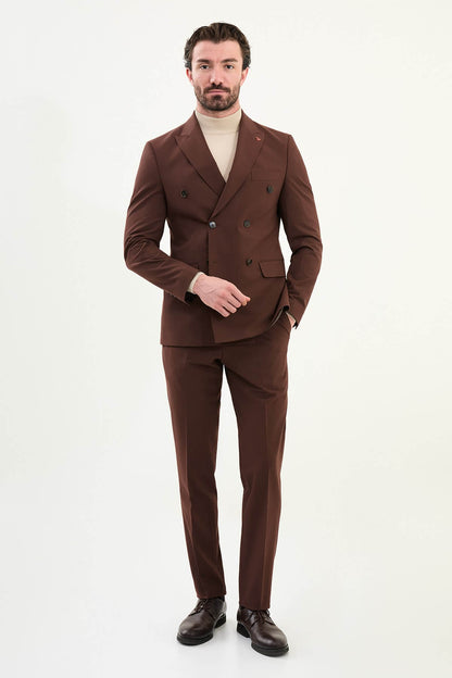 Men’s deep chocolate brown slim-fit double-breasted 6x2 suit with peak lapels, cotton-wool-viscose blend with stretch, designed for breathable comfort and wrinkle-resistant wear, styled with a cream turtleneck.